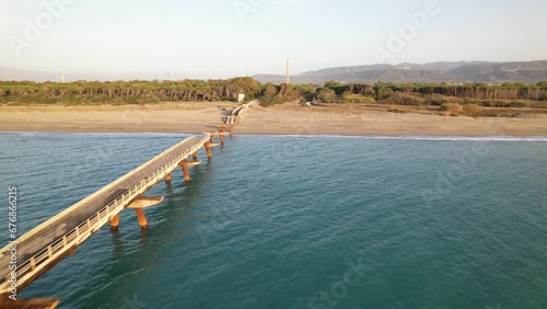 Wallpaper Mural The 670 meter structure was built in the 70s. Symbol of the degradation and abandonment of the area, today it has definitively collapsed in the initial part, sinking into the sea shore of the Gulf of  Torontodigital.ca