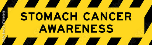 Yellow and black color with line striped label banner with word stomach cancer awareness