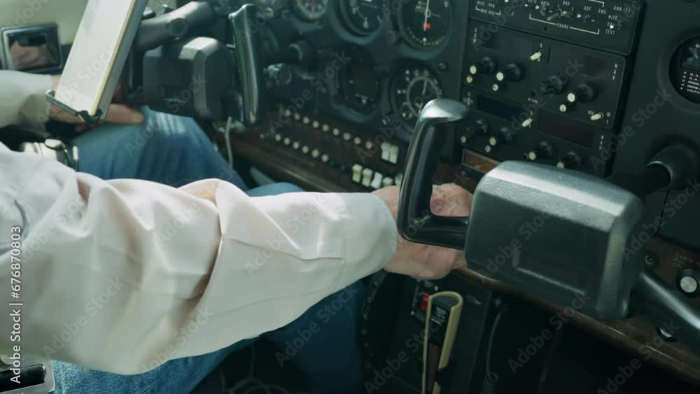 Pilot inside of a small private airplane preparing to take off. Pilot inside of a small private airplane preparing to take off.