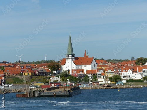 Coastline and buildings at Bornholm Island on a blue sky background