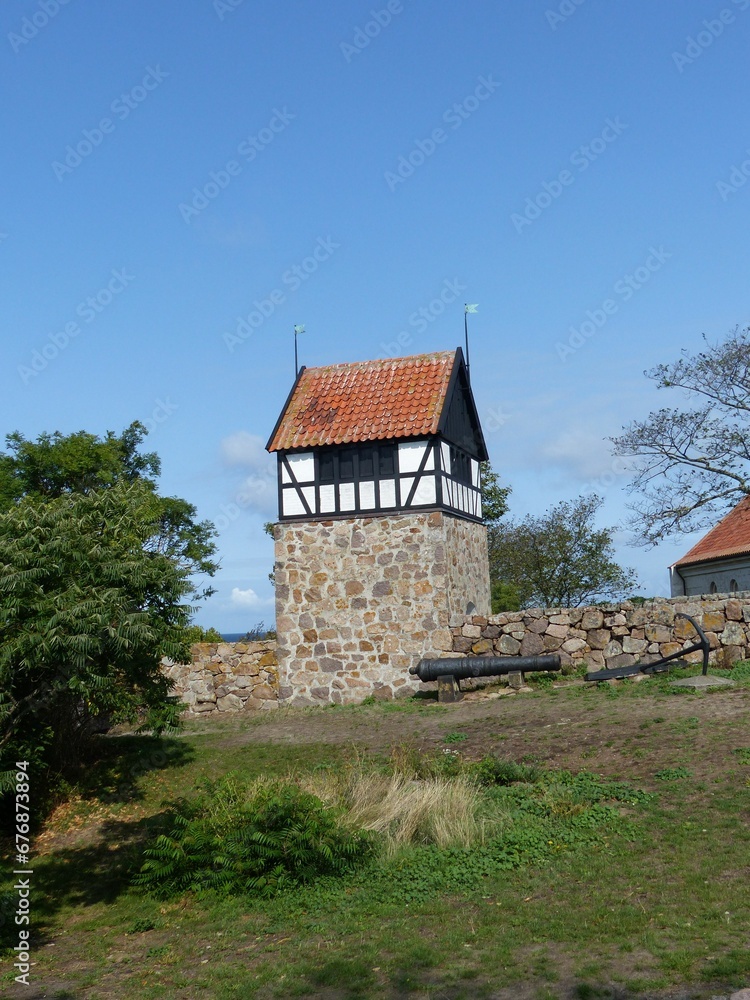 Vertical shot of a church house on stones at Bornholm island on a sunny day