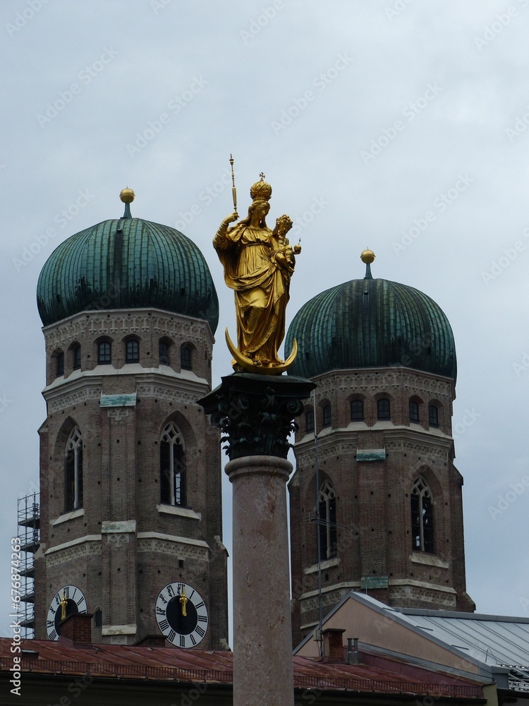 Munich Frauenkirche buildings behind golden statue