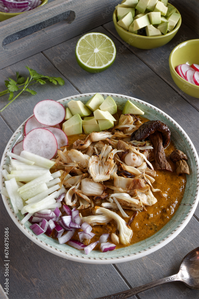 Vegan Pozole topped with fresh vegetable ingredients. Mexican cuisine homemade food with jackfruit instead of meat... Vegan Pozole topped with fresh vegetable ingredients. Mexican cuisine homemade food with jackfruit instead of meat...