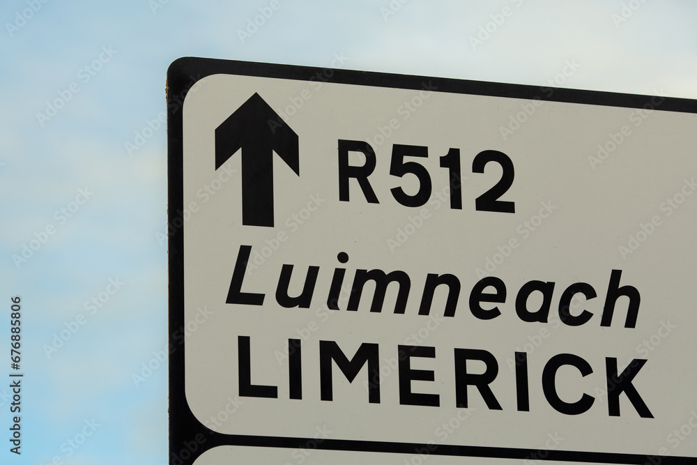 Travel concept. Information board on road. Way to Limerick, Ireland. Close up. Outdoor shot