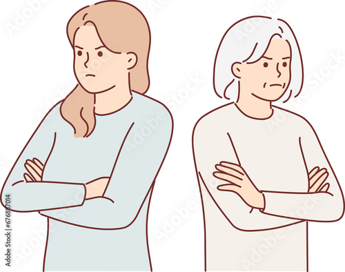 фотографія Offended women of different ages stand with arms crossed and look to side after