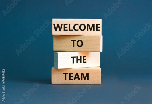 Welcome to the team symbol. Concept words Welcome to the team on wooden block. Beautiful white table white background. Business, motivational and welcome to the team concept. photo