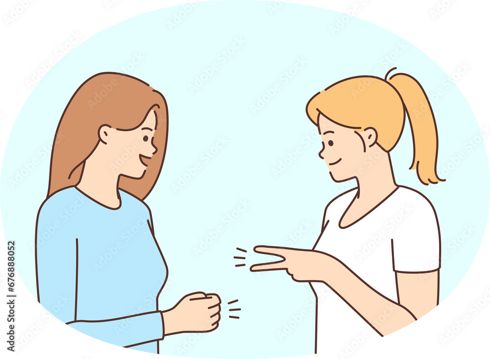 Smiling girls playing hand game Smiling girls playing hand game