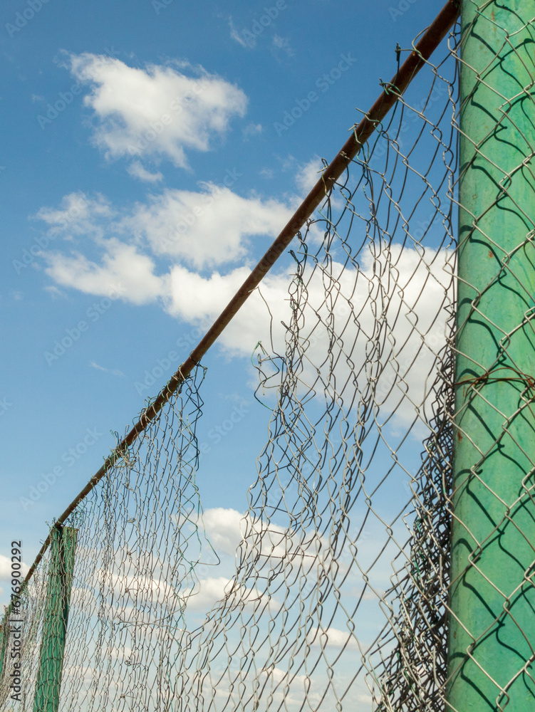 Broken metal mesh fence Broken metal mesh fence