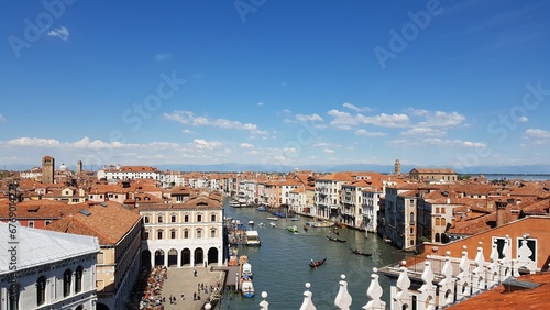 Beautiful view of red roofs of the buildings and the channel of the Venice city in summer