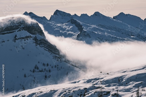 Mesmerizing view of snow-capped mountains in the Alps in winter, Falcade, Dolomites, Italy photo