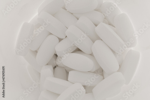 Magnesium tablets are white in a jar