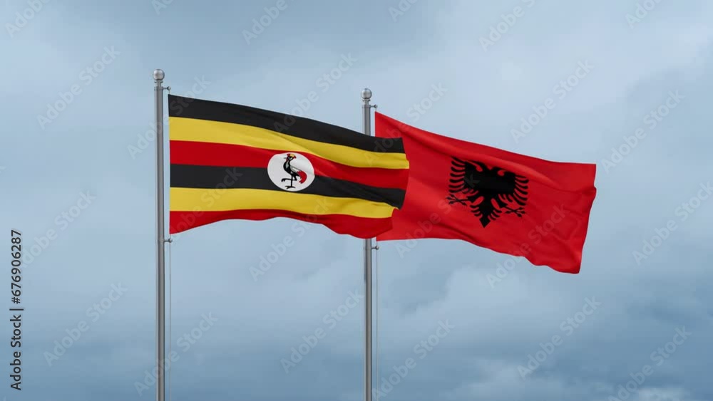 Uganda flag and Albania flag waving together on cloudy sky, endless seamless loop Uganda flag and Albania flag waving together on cloudy sky, endless seamless loop
