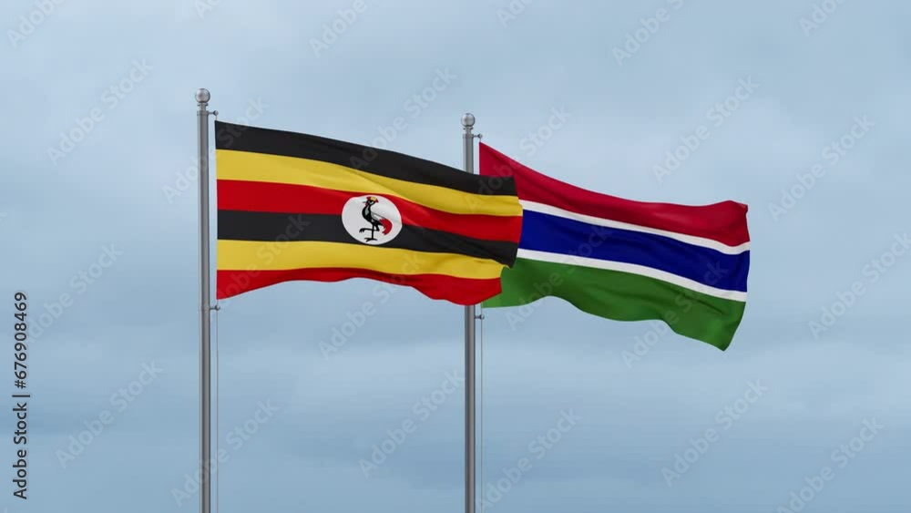 Gambia flag and Uganda flag waving together on cloudy sky, endless seamless loop, two country relations concept Gambia flag and Uganda flag waving together on cloudy sky, endless seamless loop, two country relations concept