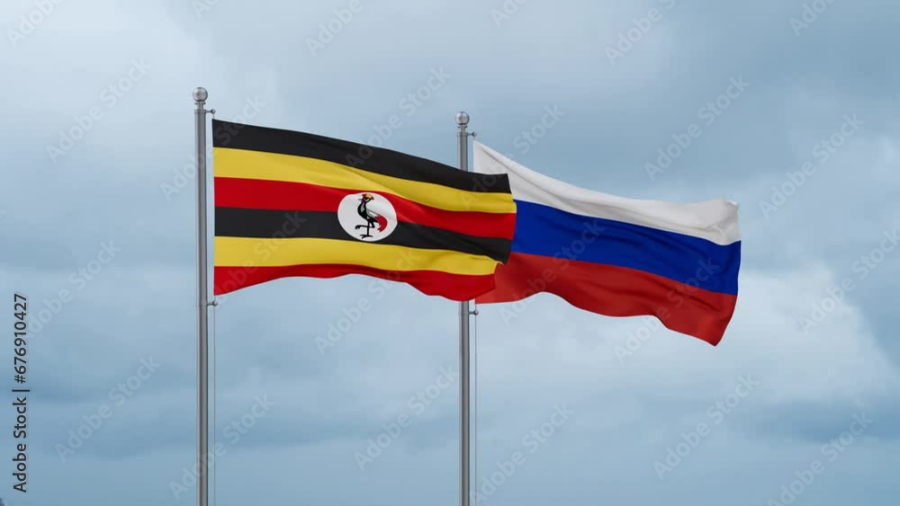 Russian Federation and Uganda flag waving together on cloudy sky, endless seamless loop Russian Federation and Uganda flag waving together on cloudy sky, endless seamless loop
