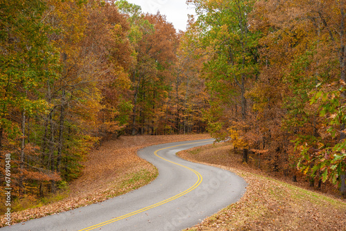 Natchez Trace Parkway road in Tennessee, USA during the fall season. The Natchez Trace Parkway is a national parkway in the Southeastern United States that commemorates the historic Natchez Trace 