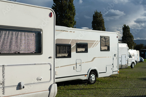Motorhome parking. Warm sun on a gray afternoon