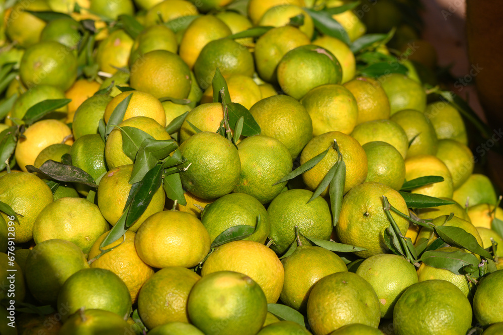 fresh appetizing tangerines at the bazaar on the island of Cyprus in autumn 2