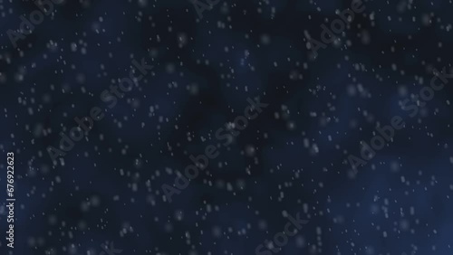 Slowly falling snow on a dark background.