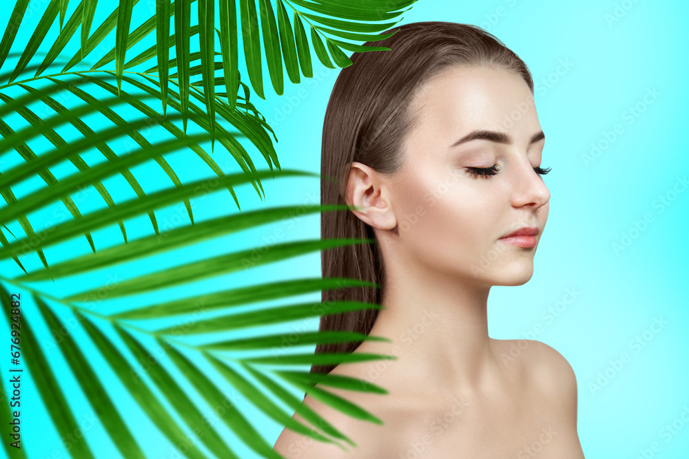 Portrait of sensual woman among tropical palm leaves. Portrait of sensual woman among tropical palm leaves.