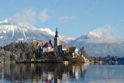 A church on an island on a lake in Bled, Slovenia. Winter. photo