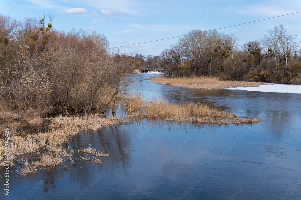 Winter river and blue sky. Landscape of winter nature. Winter river and blue sky. Landscape of winter nature.
