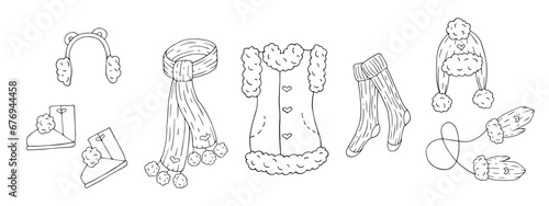 A set of sketches, doodles of winter, knitted clothes, accessories and shoes. Vector graphics.