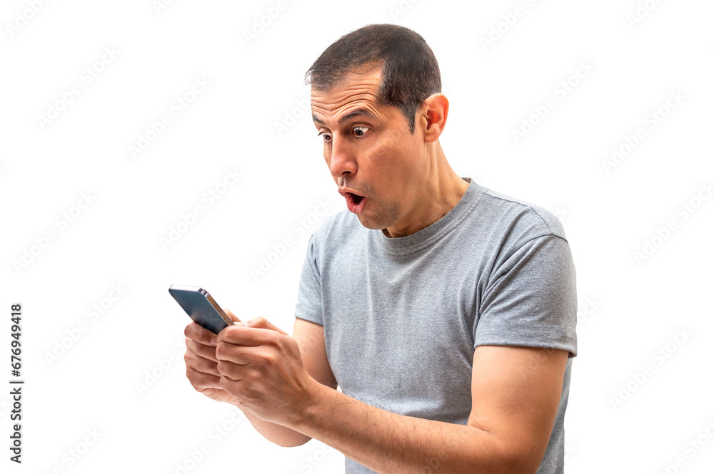 Latin man receiving surprising news on line in a smart phone with white background Latin man receiving surprising news on line in a smart phone with white background