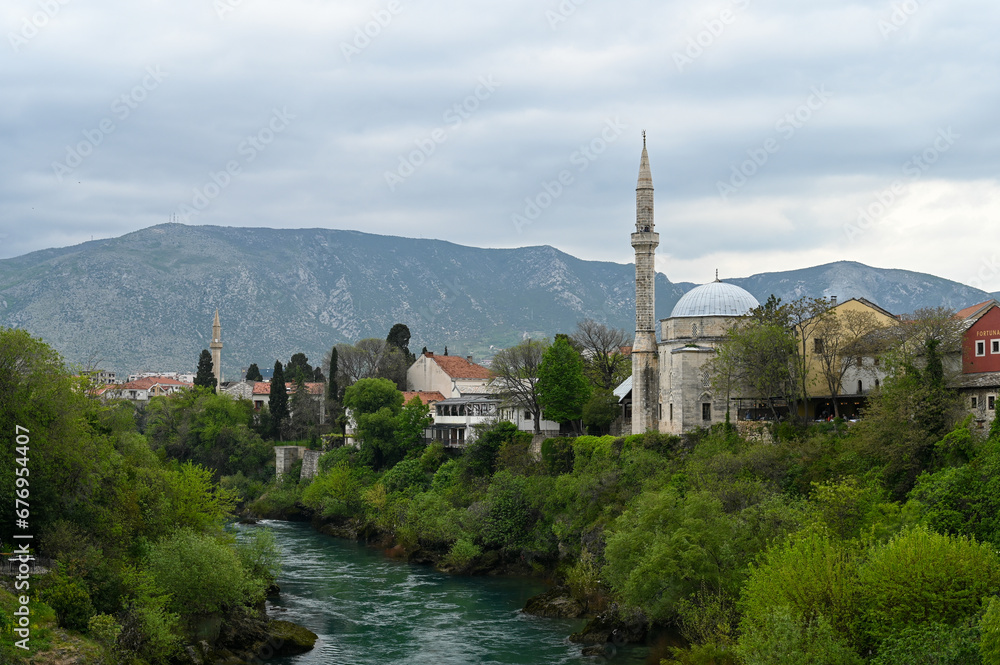 The Koski Mehmed Pasha Mosque in Mostar with Neretva river and Velez mountain in the background.