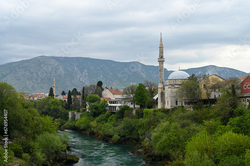 The Koski Mehmed Pasha Mosque in Mostar with Neretva river and Velez mountain in the background.