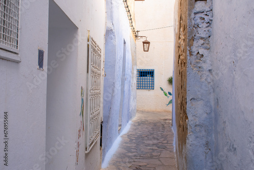 Narrow, romantic streets between houses in Medina Old Town Hammamet, Tunisia © Maciej