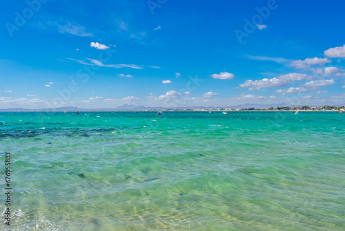 Fototapeta Naklejka Na Ścianę i Meble -  Hammamet Tunisia, Beach and  boats on shallow water, view on Mediterranean sea 
