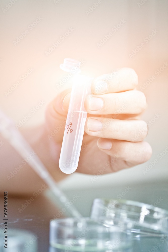 Huma hand holding test tube Huma hand holding test tube