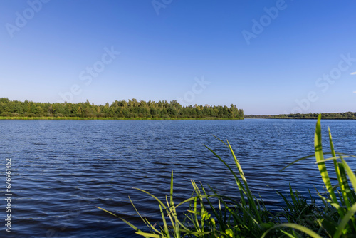 a wide river in sunny weather in early autumn