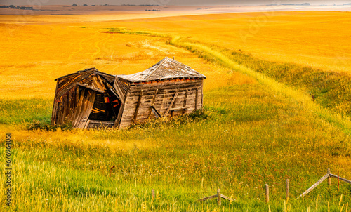 Fall drive thru the country with rustic buildings on full display. Starland County, Alberta, Canada photo