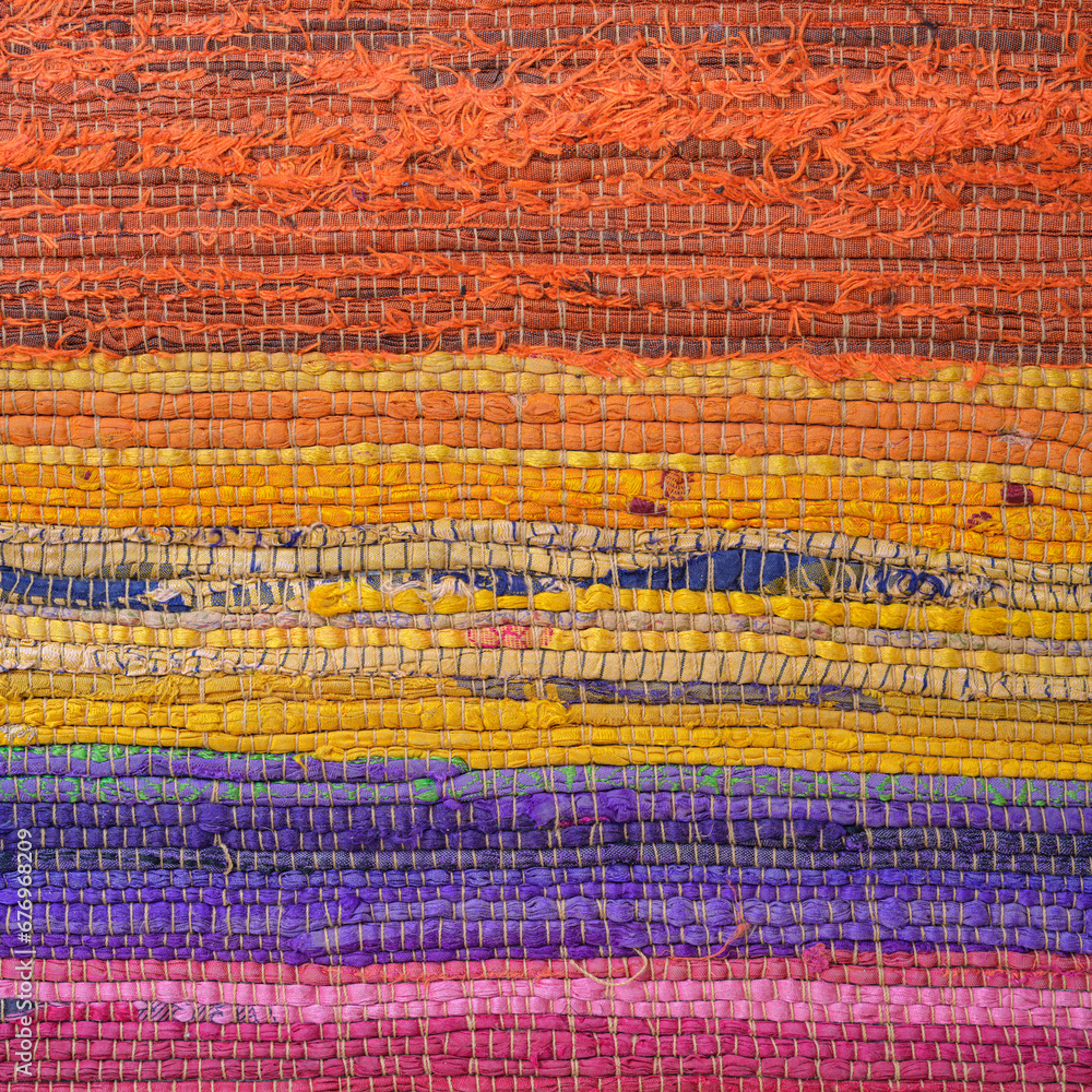 Obraz premium Detail in the colorful patterns of a rag rug