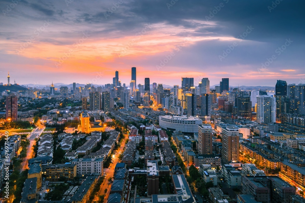 Aerial view of the stunning city skyline illuminated by the setting sun in Dalian, China