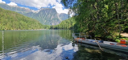 Nestled amid the picturesque landscapes of the Austrian Alps, Lake Piburg enchants with its crystal-clear waters and scenic surroundings. Surrounded by lush forests and majestic mountains, the lake re