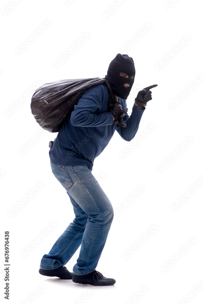 Young male burglar stealing money isolated on white
