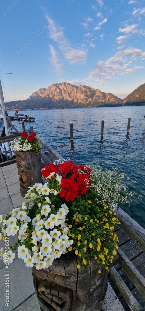 enchanting beauty of Traunkirchen am Traunsee, a picturesque village nestled on the shores of the stunning Traunsee lake in Austria. The village exudes a charming atmosphere with its historic architec