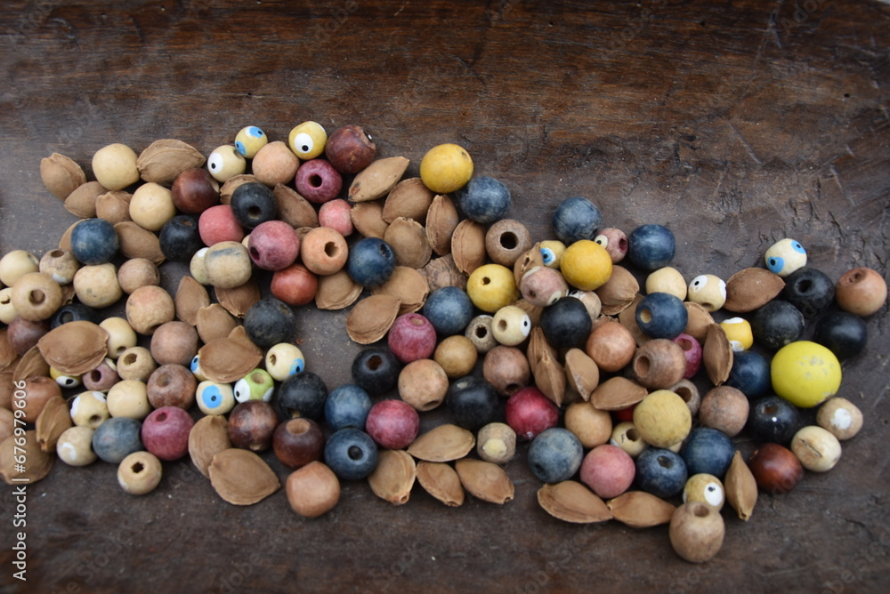 Closeup of old wooden beads with apricot pits