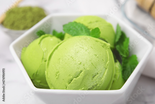 Tasty matcha ice cream in bowl on table, closeup