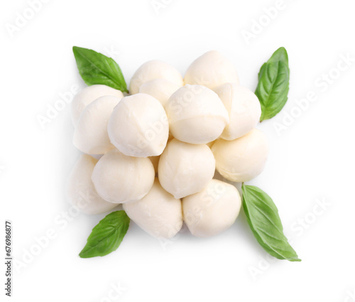 Tasty mozzarella balls and basil leaves isolated on white, top view