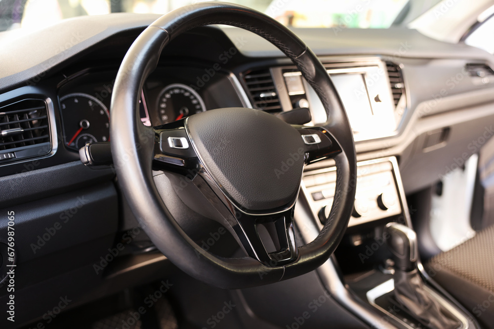 View of steering wheel and dashboard inside of modern car