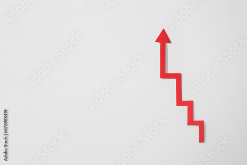 Red zigzag paper arrow on white background, top view. Space for text