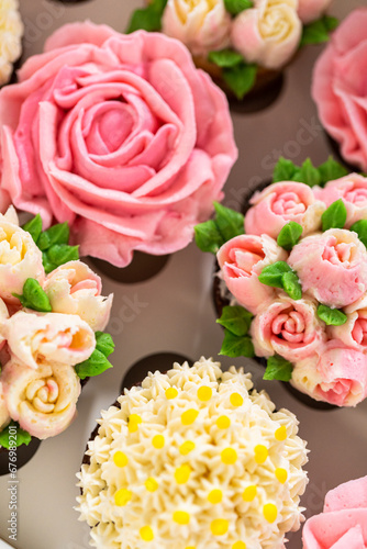 Delicious Gourmet Cupcakes Topped with Buttercream Frosting Flowers