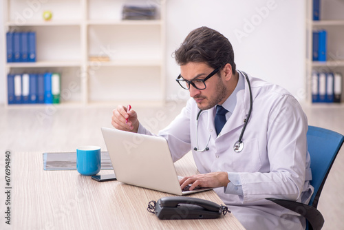 Young male doctor in telemedicine concept