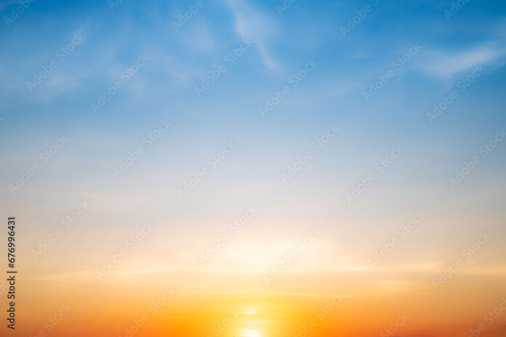 Real amazing Beautiful sunrise and luxury soft gradient orange gold clouds with sunlight on the blue sky perfect for the background, take in everning, Twilight sunset sky with gentle colorful clouds