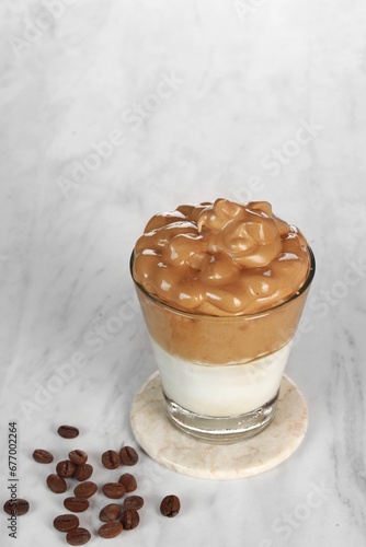 Dalgona coffee, Iced fluffy creamy whipped trend drink with coffee foam and milk
