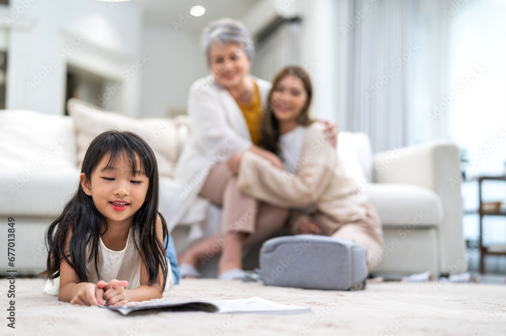 Portrait happy love asian family mother teach little daughter asian girl learn and study.Mom and asian young girl reading book and pencil making lessons in homeschool at home.Education Portrait happy love asian family mother teach little daughter asian girl learn and study.Mom and asian young girl reading book and pencil making lessons in homeschool at home.Education
