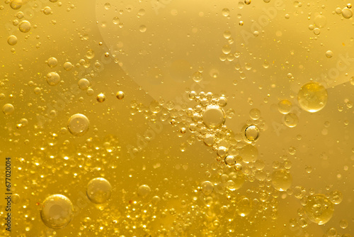 Oil bubble texture on gold background.